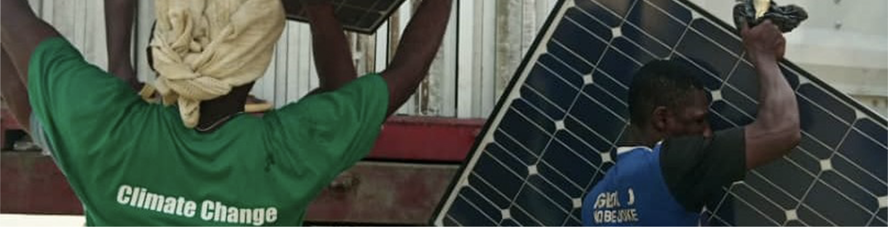 two men in Nigeria handling solahart solar panels