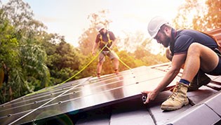 Solahart installers on a roof